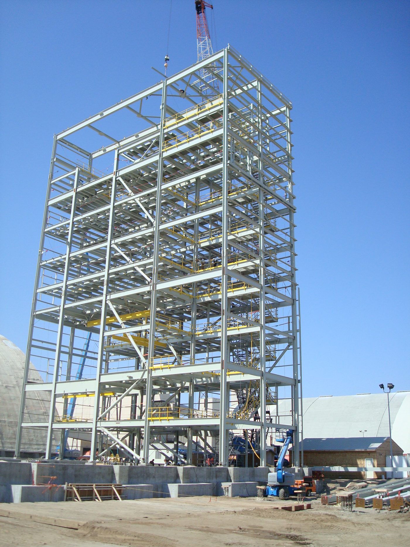 Structural steel building frame erected on site showing columns, beams and bracing.